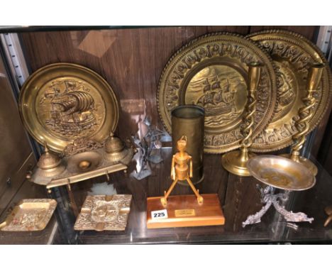 SHELF OF METALWARES INCLUDING BARLEY TWIST CANDLESTICKS, REPOUSSE BRASS WALL PLATES, BRASS INK DESK STANDISH, ASK TRAY, ETC.