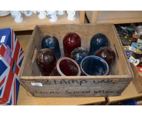 WOODEN BOX CONTAINING BLUE AND RED VINTAGE GLASS LAMP SHADES