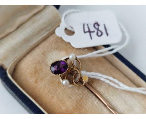 A boxed gold topped amethyst and pearl stick pin 15ct gold 1.7 gms