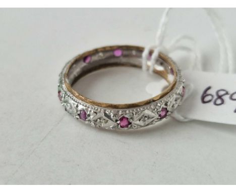 A white gold ruby eternity ring 9ct size U 2.8 gms