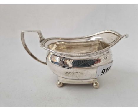 A George III cream jug on four ball feet, 6.5 inches wide, London 1910 by R &amp; S, 200 g