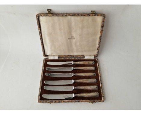 A good boxed set of six silver handled tea knives from Walker &amp; Hall