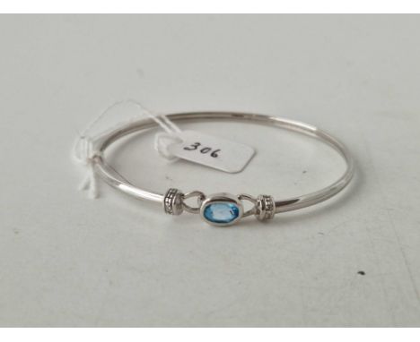 A white gold blue topaz and diamond bangle 9ct 55mm diameter 4.2 gms