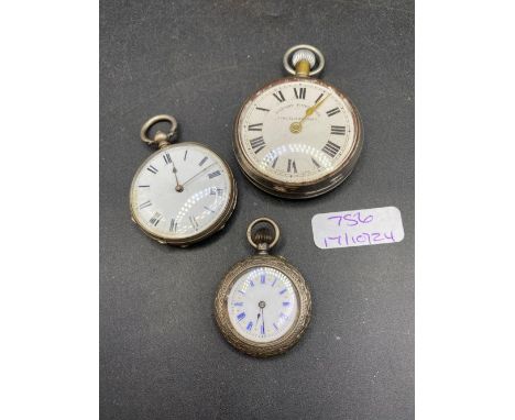 Two silver fob watches and a metal pocket watch