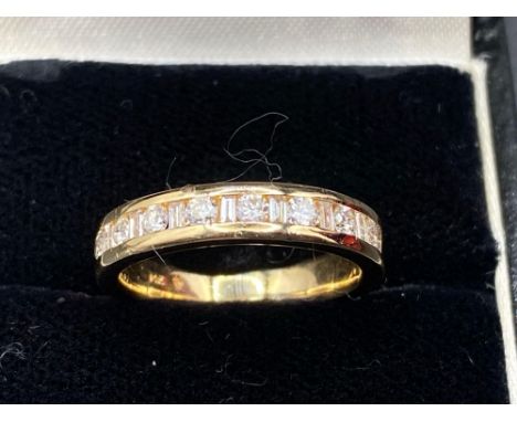 A good diamond half eternity ring alternating brilliant cut and baguette diamonds 14ct gold 0.40 carats size K 4 gms