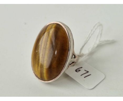 A large silver tigers eye statement ring size M