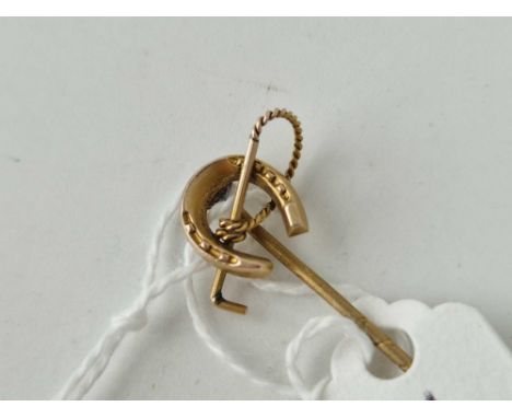 A antique gold topped equestrian stick pin