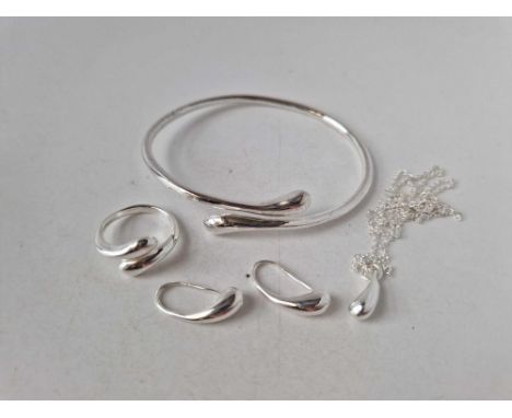 A silver suite of bangle earrings ring and pendant 33 gms