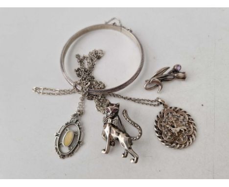 A bag with silver and marcasite cat brooch two pendants and engraved hinged bangle 35 gms