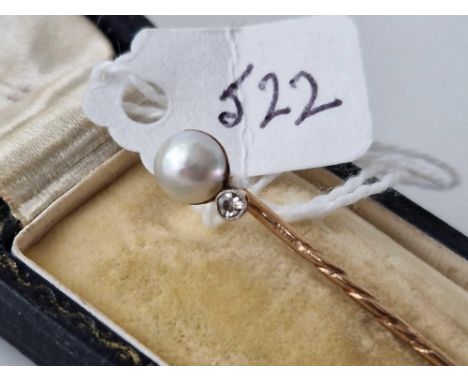 A boxed gold pearl and diamond stick pin