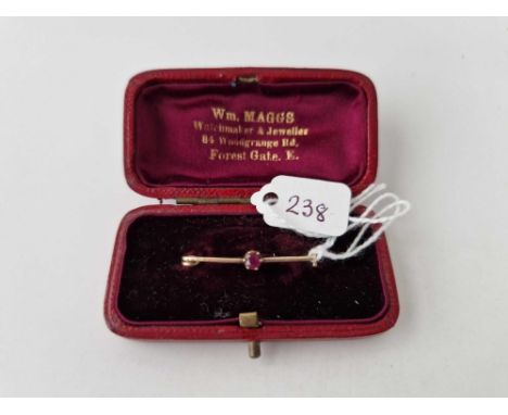 A antique ruby brooch in original box 9ct 3 cm