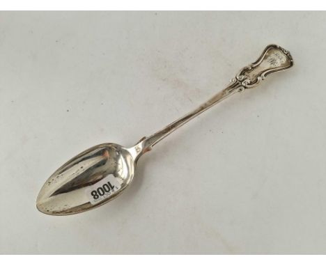 A heavy basting spoon with scroll decorated end, London 1843 by JW? 200g