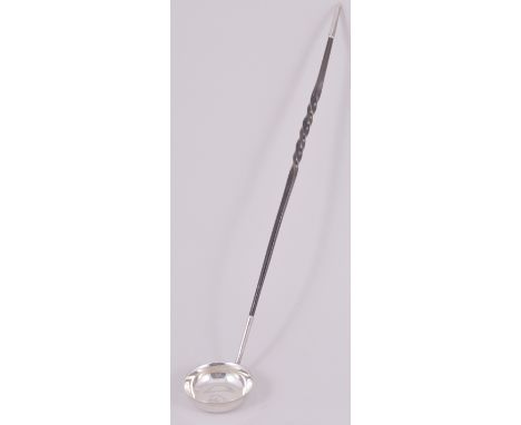 A George III style silver toddy ladle, by Willliam Hutton & Sons Limited, London 1903, round bowl with engraved crest within 