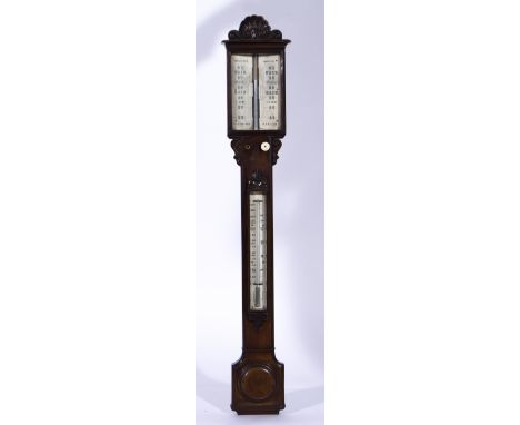 A Victorian walnut stick barometer, ivorine charts, signed Walter E. Pain, Cambridge, pediment piece with a scallop shell and