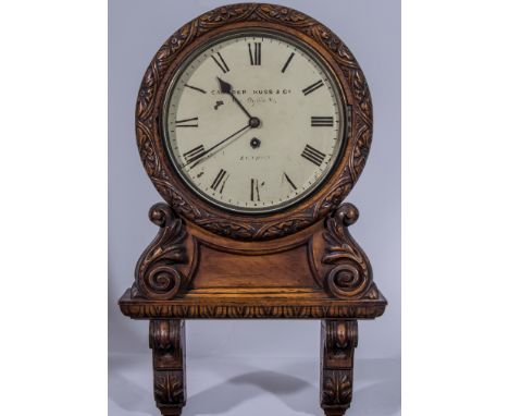 A Victorian carved walnut wall clock, white enamelled dial, signed Camerer, Kuss & Co., New Oxford Street, London, single fus
