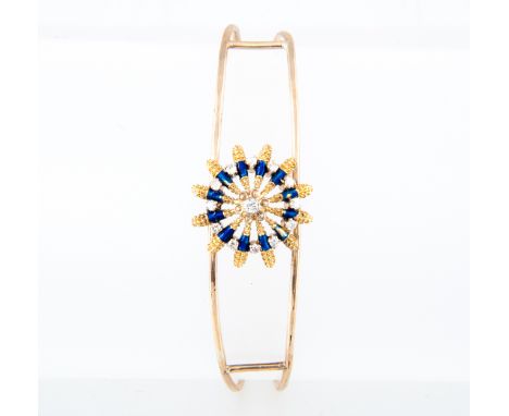 A diamond and blue enamel bangle, a yellow metal wire work bangle stamped 9ct with circular floral motif to the centre set wi