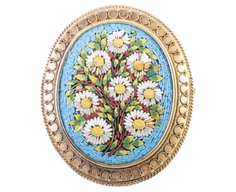 A micro mosaic brooch, the oval mosaic plaque 32mm x 26mm, having a spray of white michaelmas daisies on a turquoise ground, 