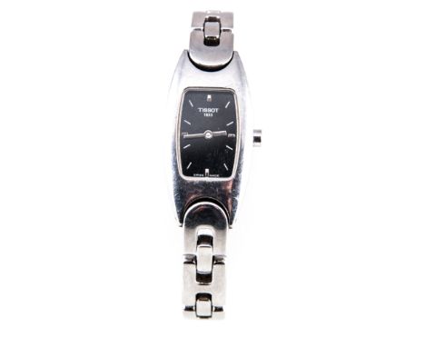 Tissot - A lady's stainless steel wrist watch, rectangular black baton dial in a stainless steel case with integral bracelet,