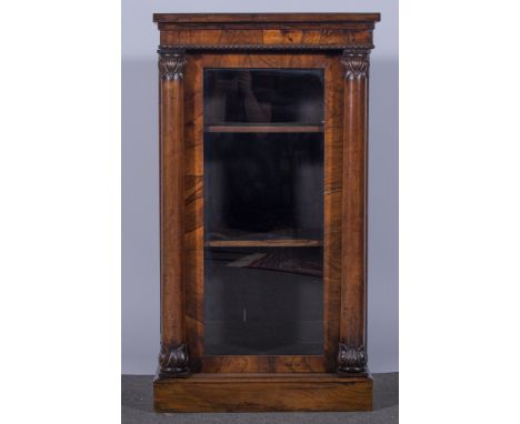 A William IV rosewood pier cabinet, projecting frieze with bobbin moulded outline, glazed panel door incorporating twin engag