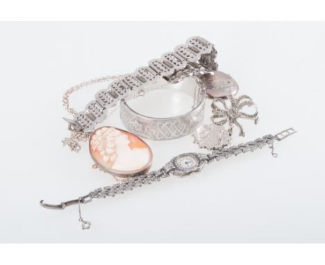 A collection of silver and white metal jewellery, a 20mm wide half hinged bangle with engraved pattern to front, oval silver 