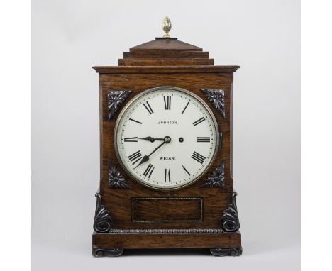 A William IV rosewood mantel clock, sarcophagus hood with gilt metal pineapple finial, applied scrolls and rosette spandrels,