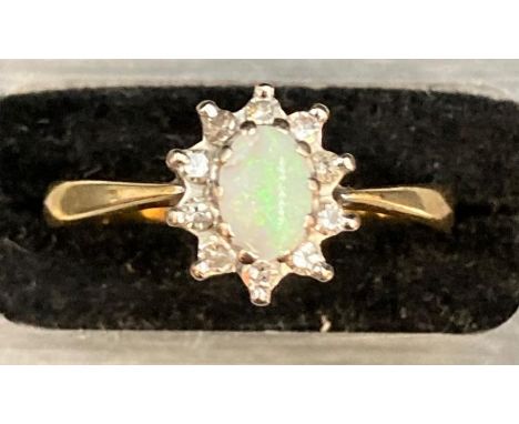 An Opal ring in an 18ct gold setting and mount. Approximate Size P