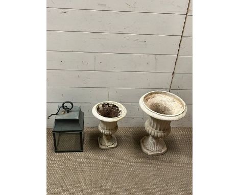 Two amphora urns and a glazed outside porch light 