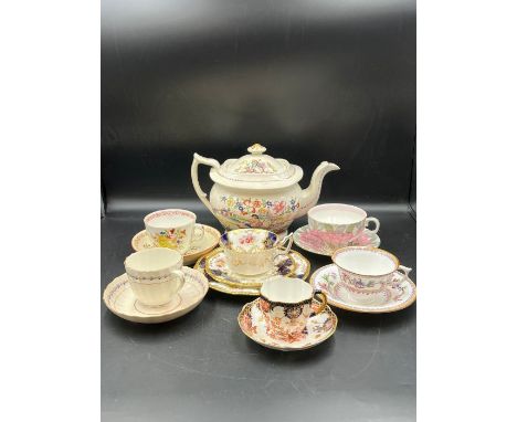 A selection of china tea cups and saucers along with a teapot, various makers and ages, to include Coalport, Doulton, Royal C