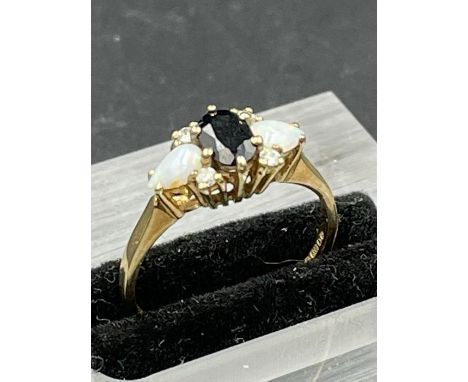 A Sapphire ring on 9ct gold with opal shoulders Size N1/2 