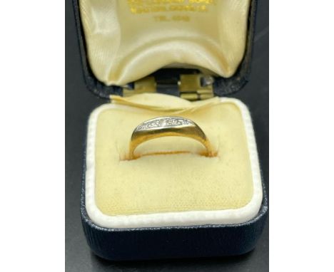 An 18ct gold ring with platinum setting Size L