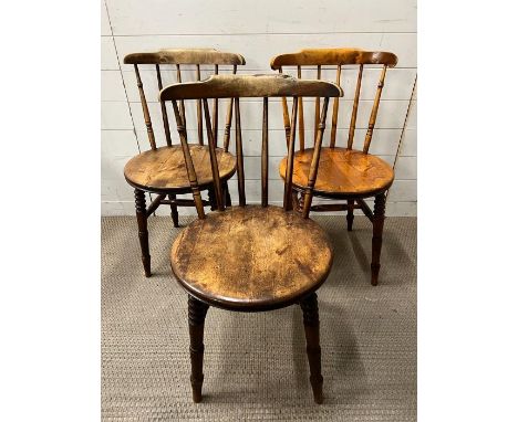 Three Elm Penny chairs, stick back and penny shape seat on turned legs 