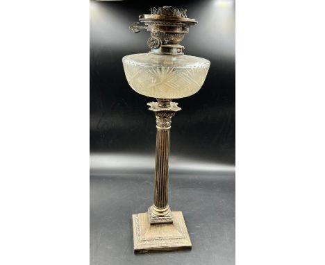 A hallmarked silver Corinthian column candlestick converted to oil lamp (Approximate Height 52cm)