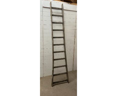 A vintage wooden Y frame ladder