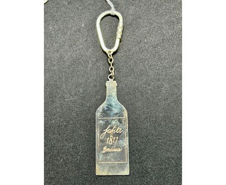 An Asprey, engraved silver bottle shaped key ring.