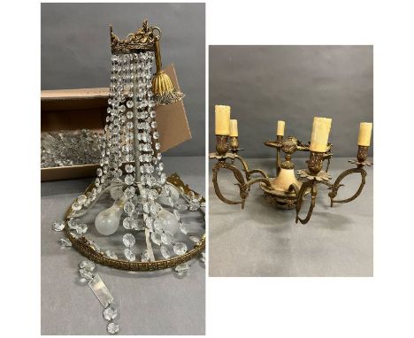 A crystal basket chandelier and a brass six arm light fitting 