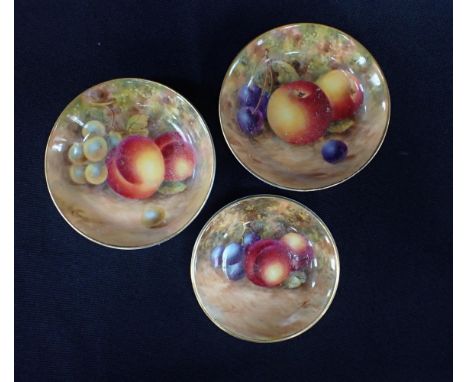 A PAIR OF ROYAL WORCESTER PIN TRAYSpainted with fruit by Creese 8.5cm dia, with a similar small pin tray painted by Theemay, 