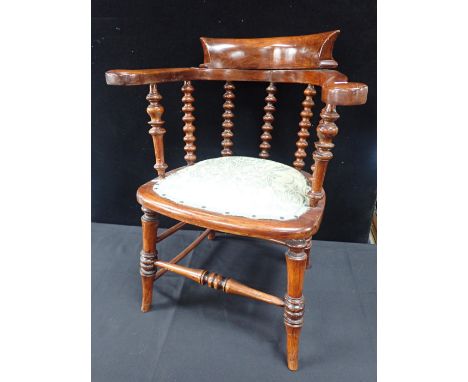 A VICTORIAN BEECH 'CAPTAIN'S' CHAIRwith bobbin-turned spindles, and pincushion seat (originally caned)