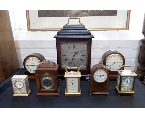 A KINGLSEY ENAMELS QUARTZ CARRIAGE TIMEPIECE13cm high, another similar by Halcyon Days, a London Clock Co brass carriage time