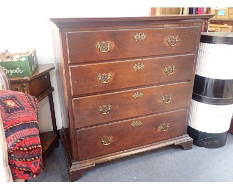 A GEORGE III OAK CHEST OF DRAWERSfour drawers of nailed construction with thumbnail moulded edges (a/f), pierced brass handle