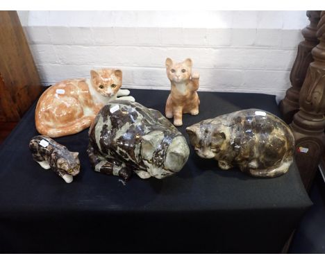 FIVE WINSTANLEY POTTERY CATSthe largest 32cm long