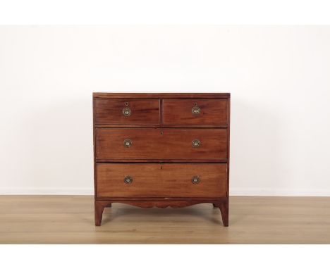 A GEORGE III MAHOGANY CHEST OF DRAWERStwo short upper drawers above two long drawers, shaped apron with splayed bracket feet,