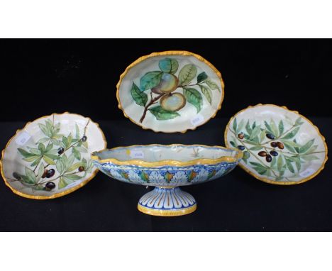 A CANTAGALLI MAJOLICA FOOTED DISHdecorated with fruit 20cm dia. (a/f), and three smaller dishes