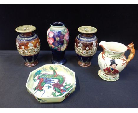 A MOORCROFT VASE25.5cm with two Doulton vases (repaired), Bursley Ware dragon bowl and musical hunting jug (5)
