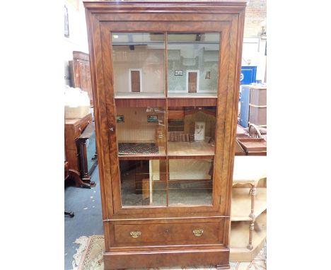 A LARGE CABINET DOLL'S HOUSEmade from a French 19th century mahogany armoire, with glazed door, enclosing six rooms, wired fo