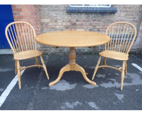 A GEORGIAN STYLE LIGHT OAK TRIPOD TABLE108cm dia (modern), and two similar Windsor chairs with crinoline stretchers (3)