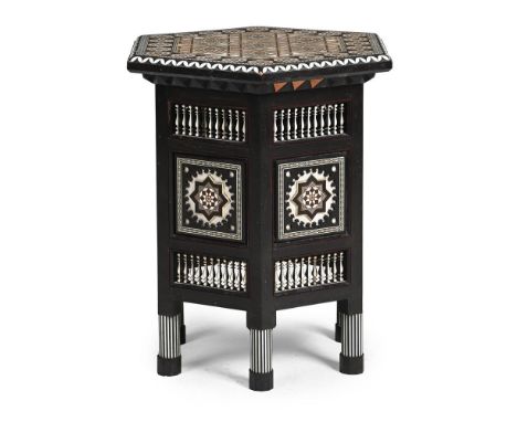 Y AN ITALIAN EBONY AND IVORY PARQUETRY TABLE BY APOLLONIO MANAIGO E COLLI, CORTINA, LATE 19TH OR EARLY 20TH CENTURY The micro