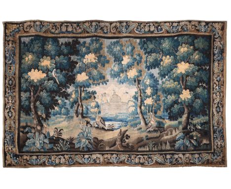 A LARGE VERDURE TAPESTRY  FRENCH, LATE 17TH CENTURY  The central field with various birds, chateau in the distance, some alte