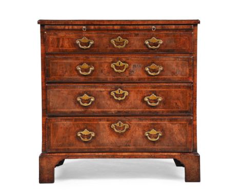 A GEORGE II FIGURED WALNUT AND FEATHERBANDED BACHELOR'S CHEST OF DRAWERS IN THE MANNER OF GILES GRENDEY, CIRCA 1740 The quart