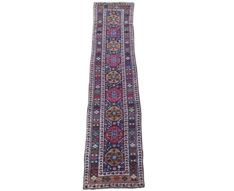 A KURDISH RUNNER  approximately 440 x 95cm 