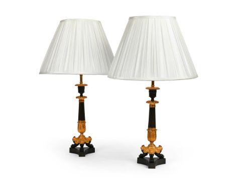 A PAIR OF FRENCH GILT AND PATINATED BRONZE TRIFORM LAMP BASES  FIRST HALF OF THE 19TH CENTURY AND LATER  Now wired, with plea